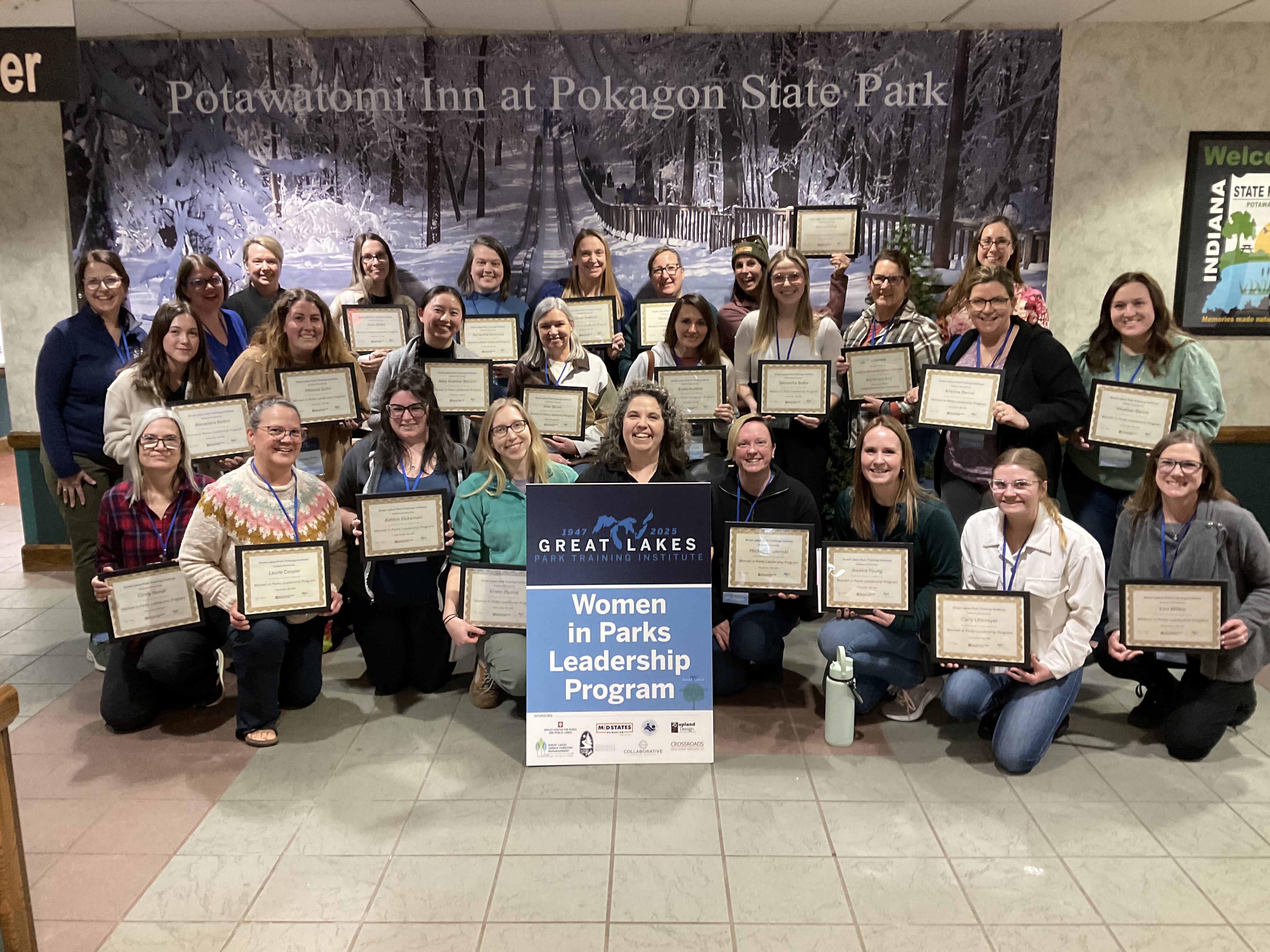 Graduates of the 2025 WPL program holding their certificates 